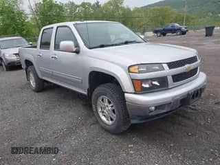2011 Chevrolet Colorado 1LT z VIN 1GCHTCFE4B8111542, wystawiony jako IAAI lot #42168554 z przebiegiem 79 611 mil mil oraz . Historia ofert i sprzedaży dostępna na DreamBid. Obrazek 1.