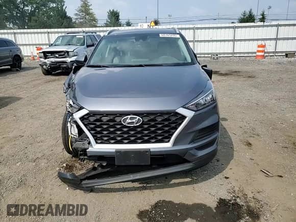 2021 Hyundai Tucson Value with VIN KM8J33A47MU389759, listed as a Copart auction lot 68165295 with 77,447 mi miles and Salvage title. Bid and sale history available at DreamBid. Image 14.