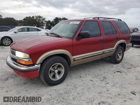 1999 Chevrolet Blazer LS с VIN 1GNCS13WXX2126904, выставлен на аукционе Copart как лот 69987244 с пробегом 384 028 миль миль и Списание • Salvage title. История ставок и продаж доступна на DreamBid. Изображение 1.