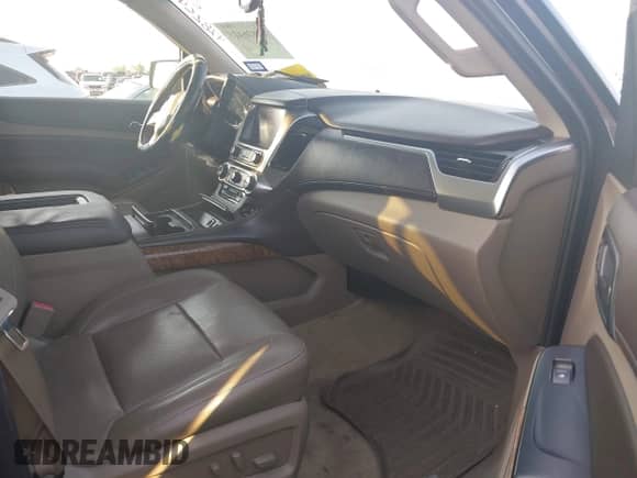 2015 Chevrolet Suburban LTZ z VIN 1GNSCKKCXFR627304, wystawiony jako IAAI lot #42826425 z przebiegiem 137 294 mil mil oraz . Historia ofert i sprzedaży dostępna na DreamBid. Obrazek 5.