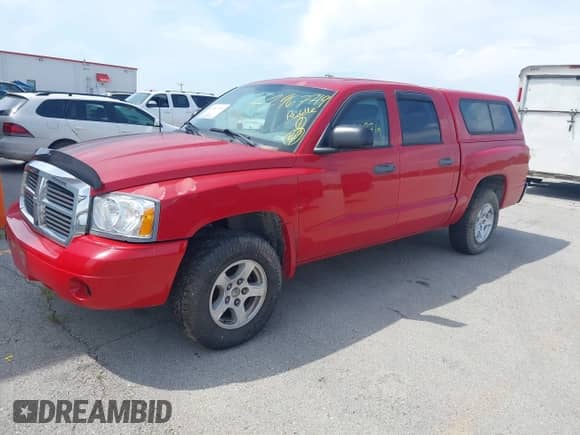2006 Dodge Dakota SLT with VIN 1D7HE48KX6S532358, listed as a IAAI auction lot 42967719 with 115,111 mi miles and . Bid and sale history available at DreamBid. Image 2.