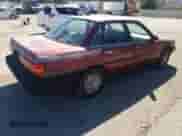 1991 Toyota Camry z VIN 4T1SV24E7MU338324, wystawiony jako Copart lot #90540185 z przebiegiem 124 473 mil mil oraz Czysty tytuł • Clean title. Historia ofert i sprzedaży dostępna na DreamBid. Obrazek 3.