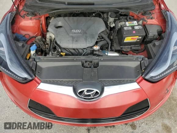 2012 Hyundai Veloster w/Red Int z VIN KMHTC6AD1CU070298, wystawiony jako Copart lot #71091355 z przebiegiem 144 305 mil mil oraz Czysty tytuł • Clean title. Historia ofert i sprzedaży dostępna na DreamBid. Obrazek 11.