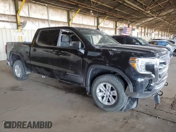 2021 GMC Sierra 1500 SLE with VIN 1GTP9BEK6MZ412290, listed as a Copart auction lot 69641215 with 120,007 mi miles and Salvage title. Bid and sale history available at DreamBid. Image 4.