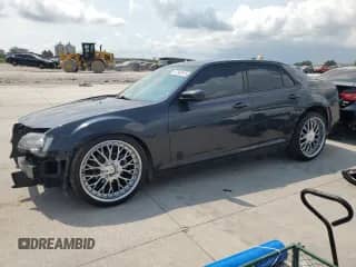 2015 Chrysler 300 S с VIN 2C3CCABG6FH887231, выставлен на аукционе Copart как лот 67840915 с пробегом 129 458 миль миль и Списание • Salvage title. История ставок и продаж доступна на DreamBid. Изображение 1.