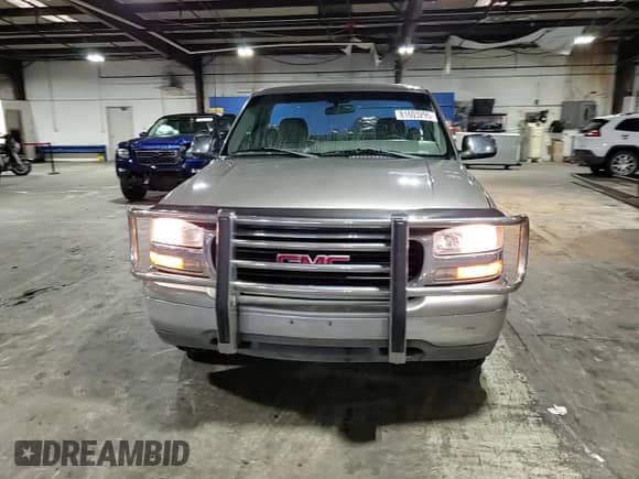 2000 GMC Sierra 1500 SLE z VIN 1GTEK14T7YE299382, wystawiony jako Copart lot #81603295 z przebiegiem 128 560 mil mil oraz Szkoda całkowita • Salvage title. Historia ofert i sprzedaży dostępna na DreamBid. Obrazek 13.