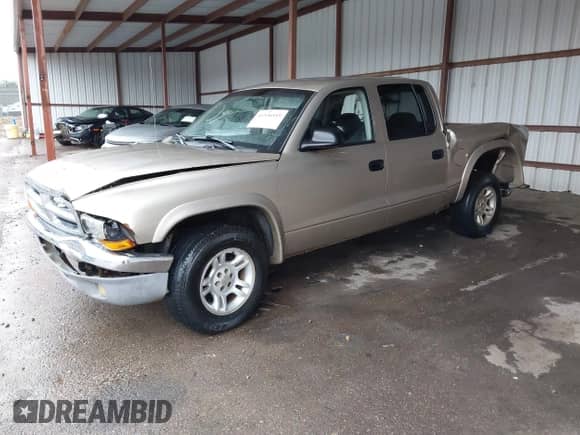 2003 Dodge Dakota SLT z VIN 1D7HL48N93S303911, wystawiony jako IAAI lot #41536555 z przebiegiem 383 306 mil mil oraz . Historia ofert i sprzedaży dostępna na DreamBid. Obrazek 2.
