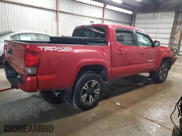2017 Toyota Tacoma SR5 with VIN 5TFCZ5AN7HX093726, listed as a Copart auction lot 82410365 with 76,422 mi miles and Salvage title. Bid and sale history available at DreamBid. Image 3.