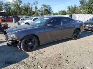 2014 Dodge Charger SXT with VIN 2C3CDXHGXEH348567, listed as a Copart auction lot 84801005 with 59,295 mi miles and Salvage title. Bid and sale history available at DreamBid. Image 1.