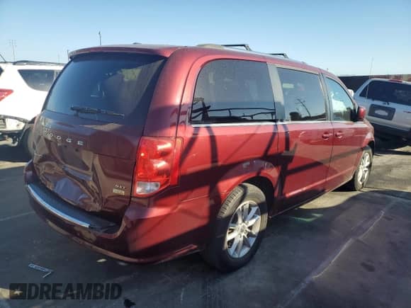 2018 Dodge Grand Caravan SXT with VIN 2C4RDGCG1JR297512, listed as a Copart auction lot 84973275 with 76,009 mi miles and Salvage title. Bid and sale history available at DreamBid. Image 3.