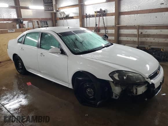 2013 Chevrolet Impala Police with VIN 2G1WD5E30D1261680, listed as a Copart auction lot 85213524 with 150,106 mi miles and Salvage title. Bid and sale history available at DreamBid. Image 4.