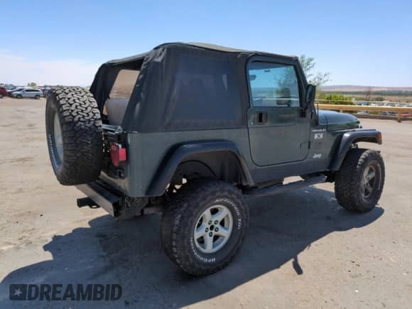 2002 Jeep Wrangler X z VIN 1J4FA39S22P776339, wystawiony jako Copart lot #57907165 z przebiegiem 154 088 mil mil oraz Szkoda całkowita • Salvage title. Historia ofert i sprzedaży dostępna na DreamBid. Obrazek 3.