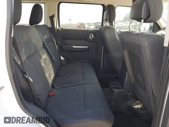 2011 Dodge Nitro SXT z VIN 1D4PU5GK5BW535223, wystawiony jako Copart lot #54922795 z przebiegiem 201 650 mil mil oraz Szkoda całkowita • Salvage title. Historia ofert i sprzedaży dostępna na DreamBid. Obrazek 11.
