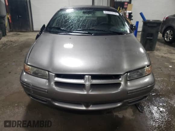 1999 Dodge Stratus with VIN 1B3EJ46X3XN562133, listed as a Copart auction lot 83203414 with 81,139 mi miles and Salvage title. Bid and sale history available at DreamBid. Image 5.