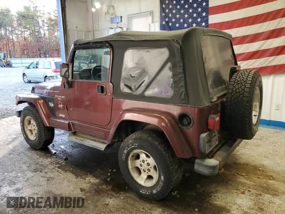 2001 Jeep Wrangler Sahara z VIN 1J4FA59S11P334534, wystawiony jako Copart lot #90651005 z przebiegiem 155 822 mil mil oraz Czysty tytuł • Clean title. Historia ofert i sprzedaży dostępna na DreamBid. Obrazek 2.