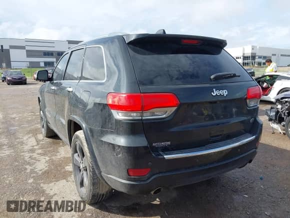 2015 Jeep Grand Cherokee Overland with VIN 1C4RJECG3FC841263, listed as a IAAI auction lot 43293918 with 158,583 mi miles and . Bid and sale history available at DreamBid. Image 3.