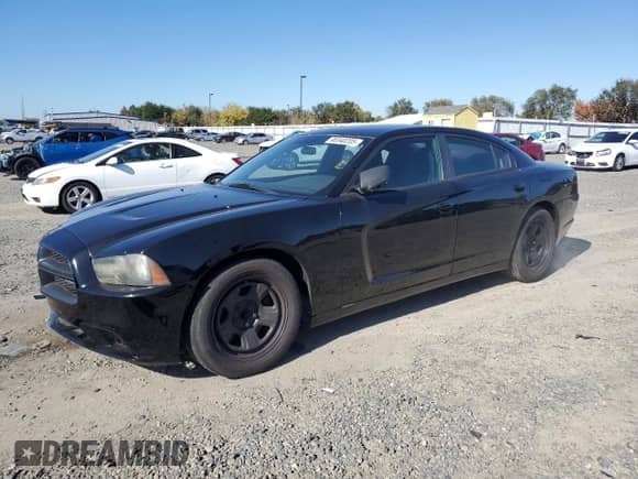 2012 Dodge Charger Police with VIN 2C3CDXAT1CH207083, listed as a Copart auction lot 90340205 with 95,434 mi miles and Clean title. Bid and sale history available at DreamBid. Image 1.