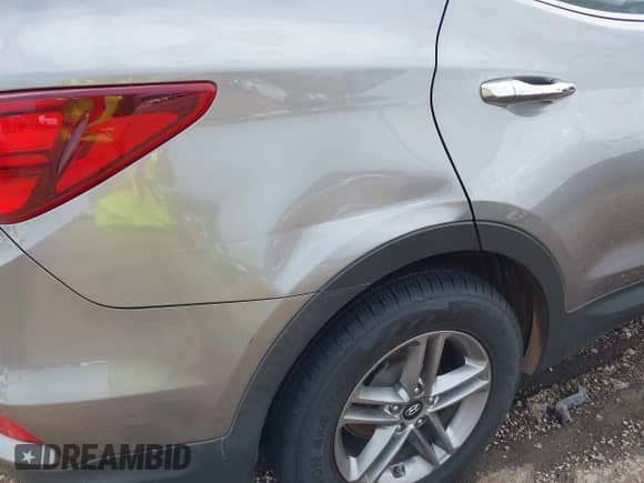 2018 Hyundai Santa Fe 2.4L with VIN 5NMZT3LBXJH095908, listed as a IAAI auction lot 43237115 with 134,010 mi miles and . Bid and sale history available at DreamBid. Image 17.