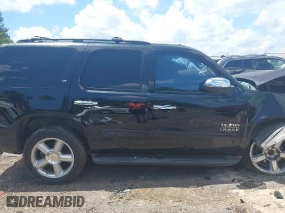 2013 Chevrolet Tahoe LT with VIN 1GNSCBE09DR366696, listed as a IAAI auction lot 42201250 with 199,105 mi miles and . Bid and sale history available at DreamBid. Image 14.