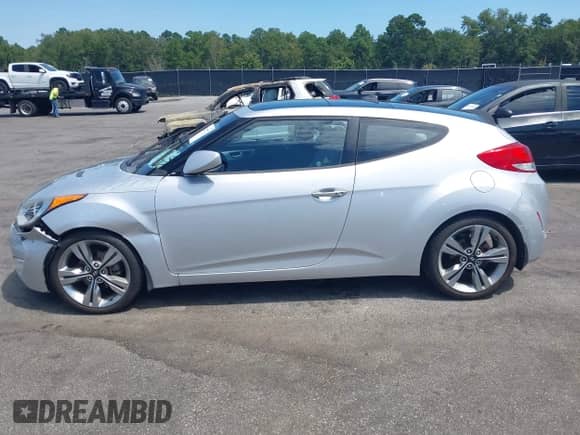 2012 Hyundai Veloster w/Gray Int z VIN KMHTC6AD0CU049684, wystawiony jako IAAI lot #43132772 z przebiegiem 114 146 mil mil oraz . Historia ofert i sprzedaży dostępna na DreamBid. Obrazek 14.
