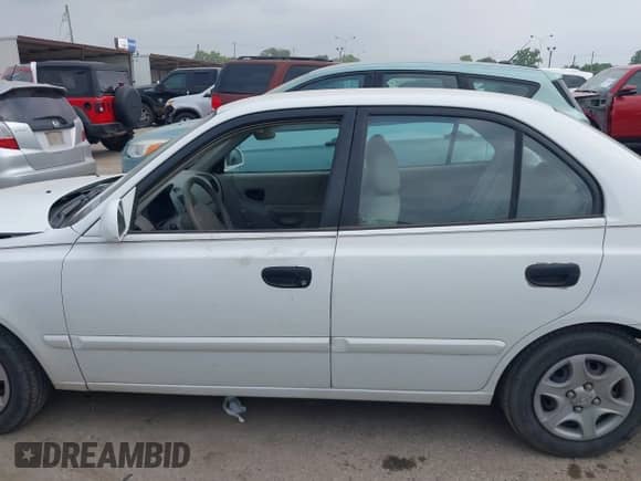 2005 Hyundai Accent GLS с VIN KMHCG45C05U595012, выставлен на аукционе IAAI как лот 42282762 с пробегом 44 985 миль миль и . История ставок и продаж доступна на DreamBid. Изображение 14.