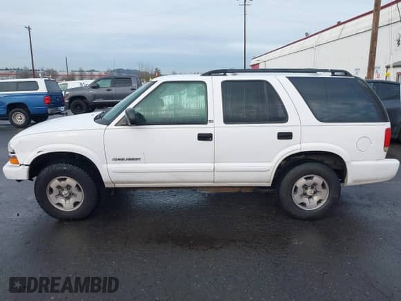 2003 Chevrolet Blazer LS with VIN 1GNDT13X63K145986, listed as a IAAI auction lot 41604061 with 158,431 mi miles and . Bid and sale history available at DreamBid. Image 14.