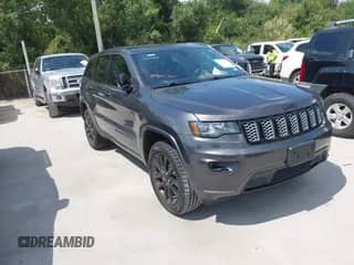 2018 Jeep Grand Cherokee Laredo E with VIN 1C4RJEAG6JC304365, listed as a IAAI auction lot 43023758 with 140,626 mi miles and . Bid and sale history available at DreamBid. Image 1.