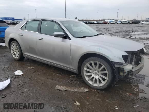 2011 Chrysler 300 with VIN 2C3CA4CG9BH573122, listed as a Copart auction lot 47869785 with 183,165 mi miles and Salvage title. Bid and sale history available at DreamBid. Image 4.