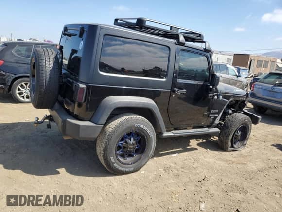 2018 Jeep Wrangler Sport S with VIN 1C4GJWAGXJL811914, listed as a Copart auction lot 65130075 with 88,622 mi miles and Salvage title. Bid and sale history available at DreamBid. Image 3.