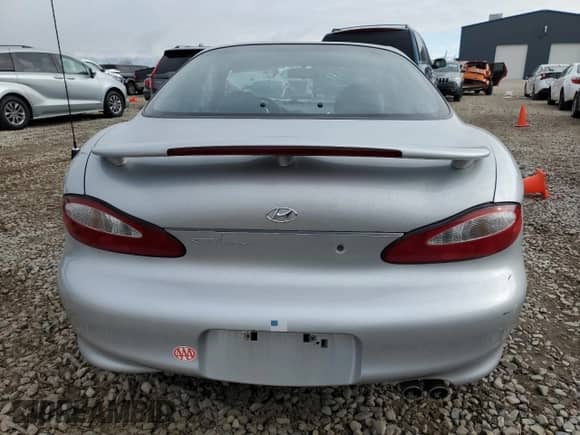1999 Hyundai Tiburon с VIN KMHJG24F8XU126762, выставлен на аукционе Copart как лот 88747725 с пробегом 51 296 миль миль и Списание • Salvage title. История ставок и продаж доступна на DreamBid. Изображение 6.
