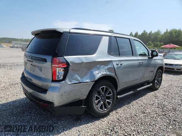 2023 Chevrolet Tahoe Z71 with VIN 1GNSKPKD0PR521471, listed as a Copart auction lot 65339615 with 57,973 mi miles and Salvage title. Bid and sale history available at DreamBid. Image 3.