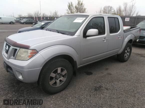 2011 Nissan Frontier Pro-4X with VIN 1N6AD0EV2BC438370, listed as a IAAI auction lot 41952484 with 217,529 mi miles and . Bid and sale history available at DreamBid. Image 17.