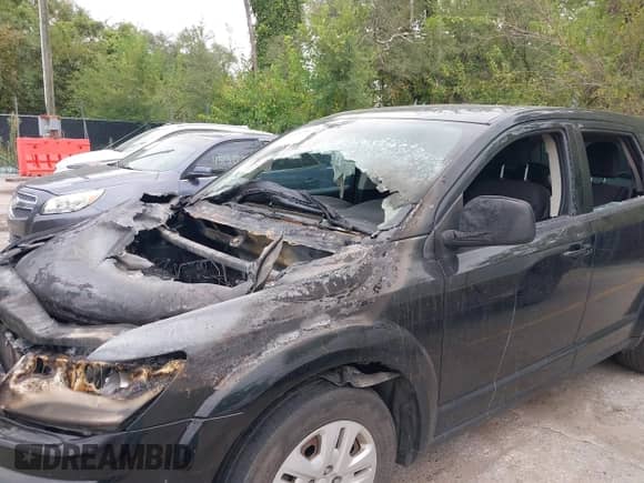 2015 Dodge Journey American Value with VIN 3C4PDCABXFT597903, listed as a IAAI auction lot 43257507 with 10,857 mi miles and . Bid and sale history available at DreamBid. Image 6.