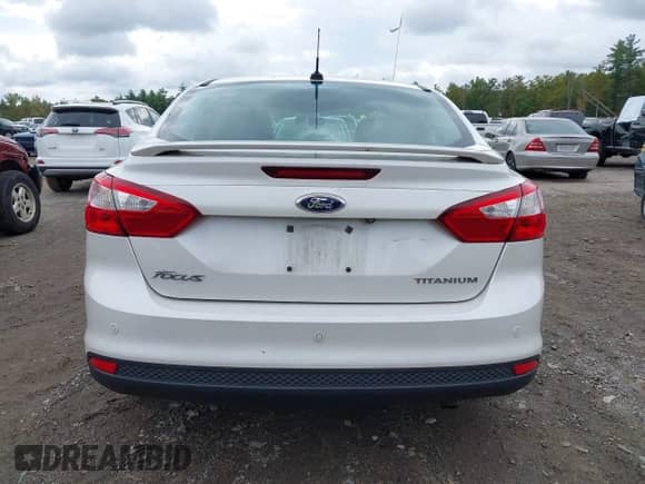 2014 Ford Focus Titanium with VIN 1FADP3J27EL215076, listed as a IAAI auction lot 43442107 with 137,959 mi miles and . Bid and sale history available at DreamBid. Image 16.