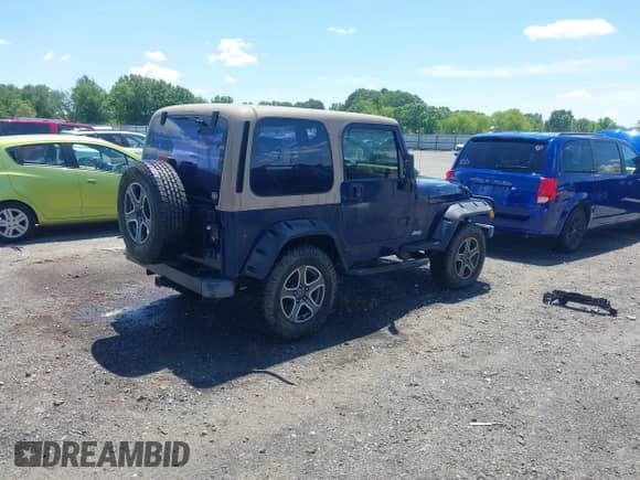 2001 Jeep Wrangler SE with VIN 1J4FA29P01P344644, listed as a IAAI auction lot 42170936 with 130,938 mi miles and . Bid and sale history available at DreamBid. Image 4.
