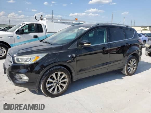 2017 Ford Escape Titanium с VIN 1FMCU0JD0HUD51218, выставлен на аукционе Copart как лот 64889695 с пробегом 118 114 миль миль и Чистый • Clean title. История ставок и продаж доступна на DreamBid. Изображение 1.