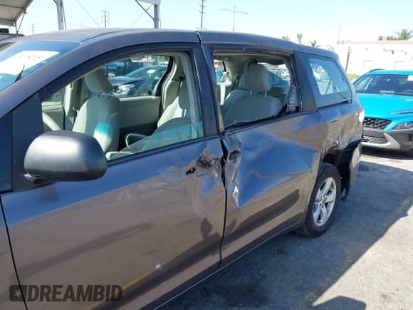 2012 Toyota Sienna with VIN 5TDZK3DC2CS271781, listed as a IAAI auction lot 43138219 with 203,854 mi miles and . Bid and sale history available at DreamBid. Image 6.