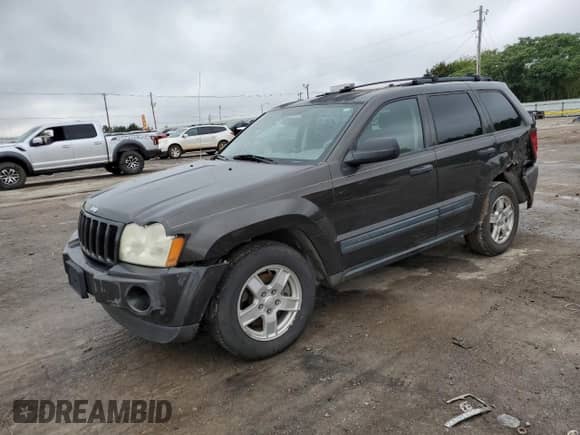 2005 Jeep Grand Cherokee Laredo with VIN 1J4GS48KX5C563594, listed as a Copart auction lot 69724645 with 189,716 mi miles and Salvage title. Bid and sale history available at DreamBid. Image 1.