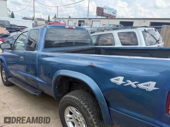 2004 Dodge Dakota Sport with VIN 1D7HG32N94S732443, listed as a Copart auction lot 66866805 with 174,556 mi miles and Clean title. Bid and sale history available at DreamBid. Image 4.