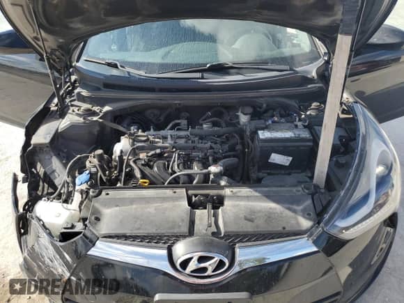 2015 Hyundai Veloster z VIN KMHTC6AD0FU237545, wystawiony jako Copart lot #69858765 z przebiegiem 182 058 mil mil oraz Szkoda całkowita • Salvage title. Historia ofert i sprzedaży dostępna na DreamBid. Obrazek 12.