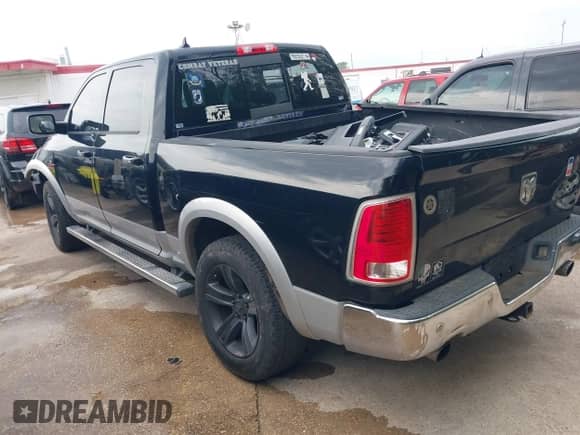 2014 Ram 1500 Laramie z VIN 1C6RR7NM7ES353887, wystawiony jako IAAI lot #42349659 z przebiegiem 206 055 mil mil oraz . Historia ofert i sprzedaży dostępna na DreamBid. Obrazek 3.