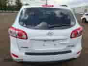 2011 Hyundai Santa Fe GLS z VIN 5XYZGDAG4BG020352, wystawiony jako Copart lot #68807315 z przebiegiem 240 957 mil mil oraz Szkoda całkowita • Salvage title. Historia ofert i sprzedaży dostępna na DreamBid. Obrazek 6.