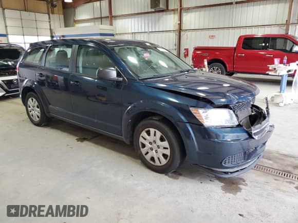 2014 Dodge Journey American Value with VIN 3C4PDCAB6ET245951, listed as a Copart auction lot 71156905 with 141,144 mi miles and Salvage title. Bid and sale history available at DreamBid. Image 4.
