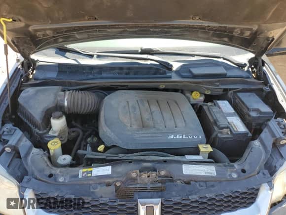 2013 Dodge Grand Caravan Crew with VIN 2C4RDGDG2DR700268, listed as a Copart auction lot 57086795 with 154,006 mi miles and Salvage title. Bid and sale history available at DreamBid. Image 12.