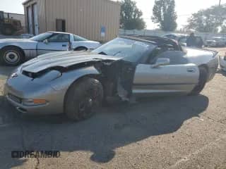1999 Chevrolet Corvette with VIN 1G1YY32G2X5128303, listed as a Copart auction lot 63449435 with 102,800 mi miles and Salvage title. Bid and sale history available at DreamBid. Image 1.