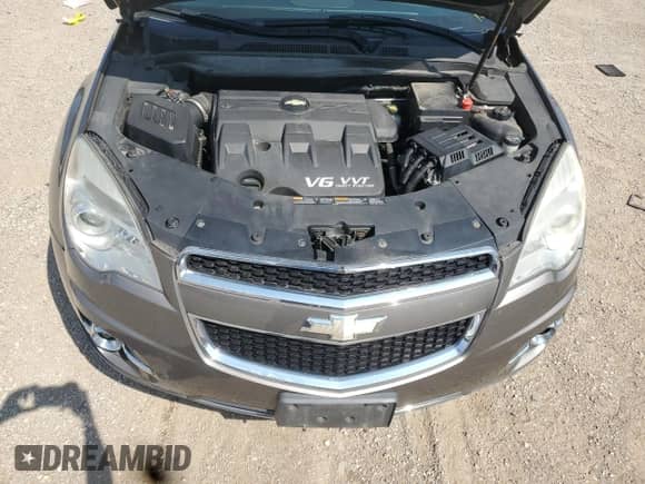 2012 Chevrolet Equinox LTZ z VIN 2GNFLFE59C6335933, wystawiony jako Copart lot #64464965 z przebiegiem 98 345 mil mil oraz Szkoda całkowita • Salvage title. Historia ofert i sprzedaży dostępna na DreamBid. Obrazek 11.