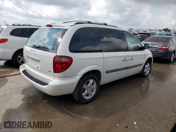 2007 Dodge Caravan SXT with VIN 1D4GP45R57B161051, listed as a Copart auction lot 58259765 with 105,658 mi miles and Salvage title. Bid and sale history available at DreamBid. Image 3.