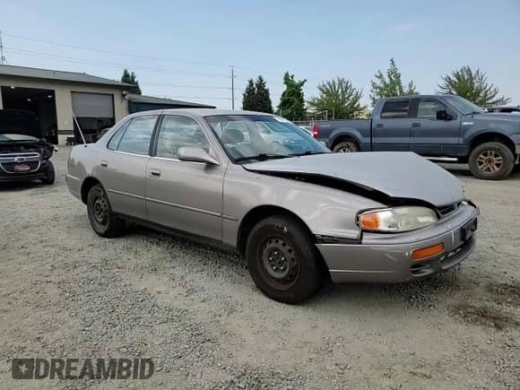 1996 Toyota Camry DX z VIN JT2BG12K9T0371115, wystawiony jako Copart lot #70061945 z przebiegiem 274 613 mil mil oraz Szkoda całkowita • Salvage title. Historia ofert i sprzedaży dostępna na DreamBid. Obrazek 13.