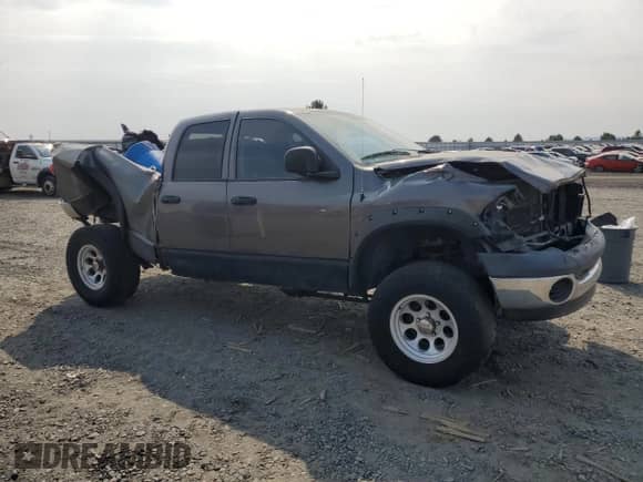 2004 Dodge 1500 SLT z VIN 1D7HU18D54J202861, wystawiony jako Copart lot #69565065 z przebiegiem 184 018 mil mil oraz Szkoda całkowita • Salvage title. Historia ofert i sprzedaży dostępna na DreamBid. Obrazek 4.