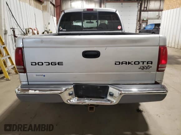 2003 Dodge Dakota Sport with VIN 1D7HG38X83S300059, listed as a Copart auction lot 61420305 with 230,971 mi miles and Salvage title. Bid and sale history available at DreamBid. Image 6.